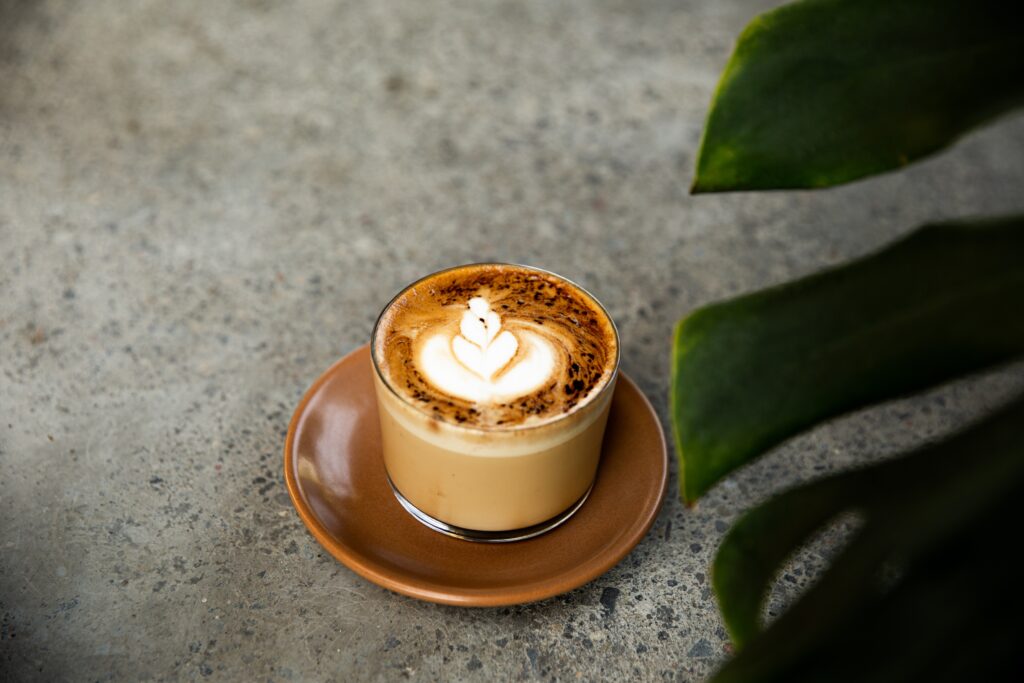 glass-of-cappuccino-with-latte-art-on-on-brown-sau-2025-02-22-04-50-28-utc